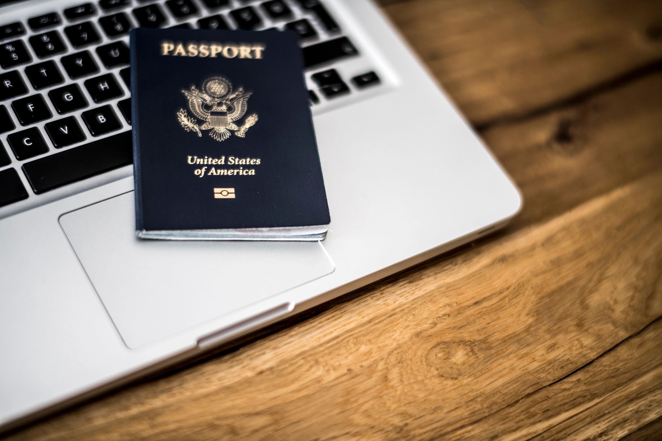 Passport and laptop representing international application support