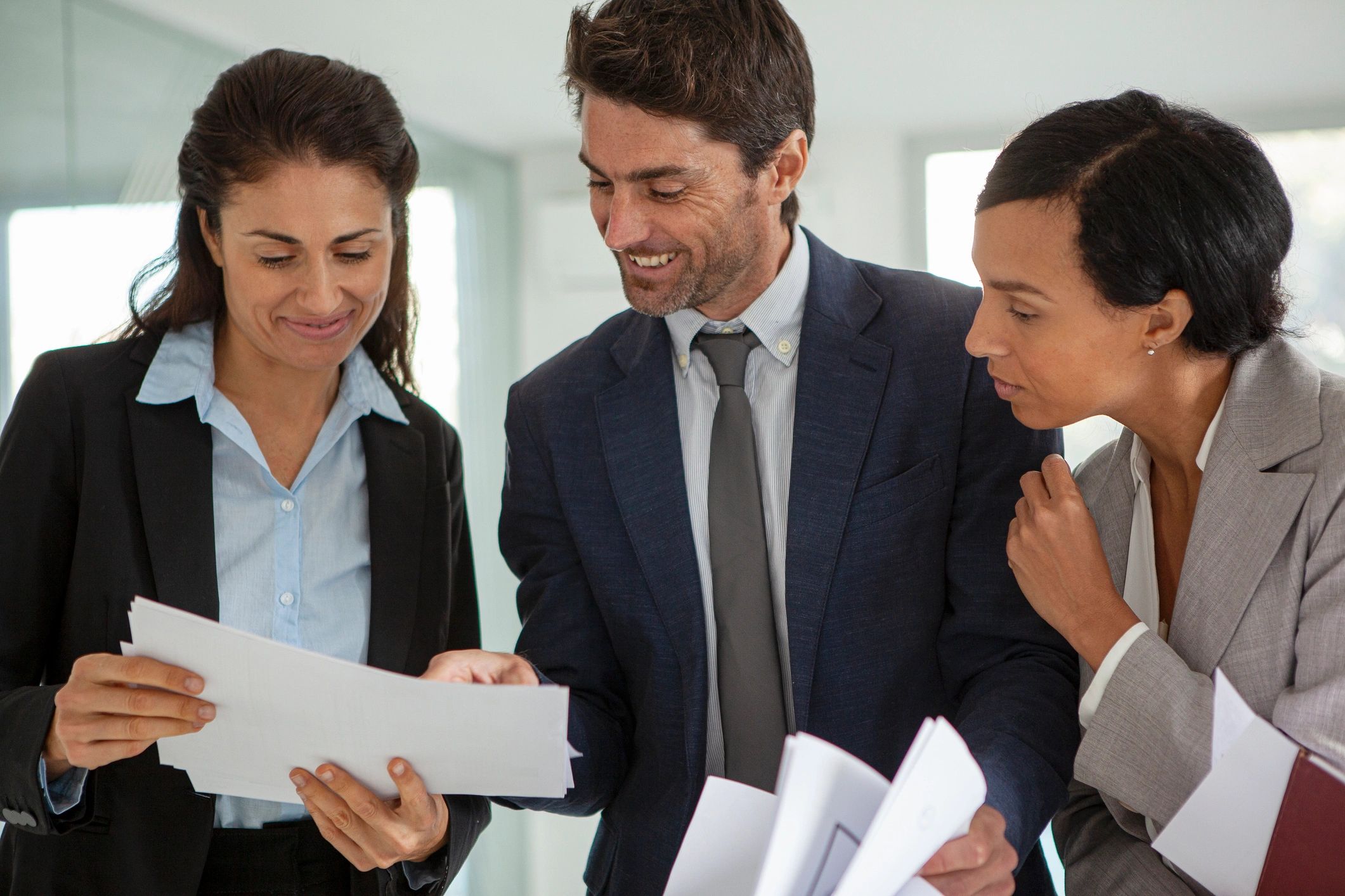 Professionals reviewing documents together